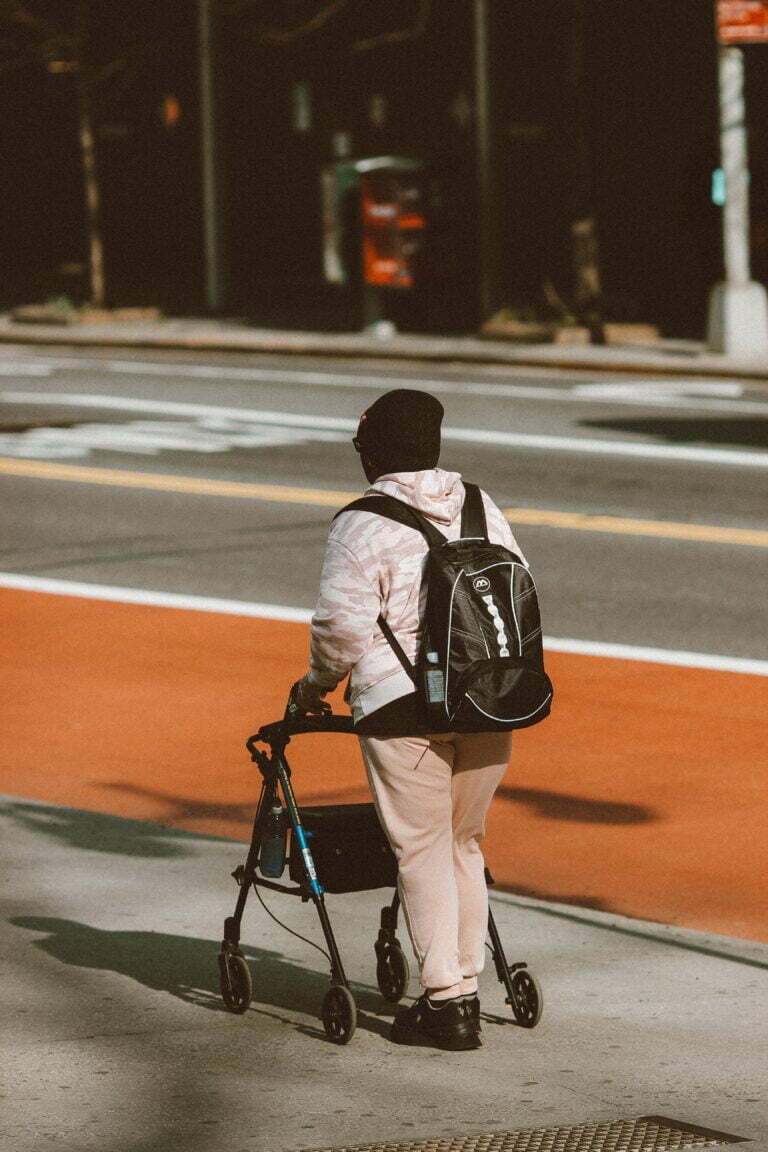 rolling walker person jon-tyson-L3QflCnMOEg-unsplash
